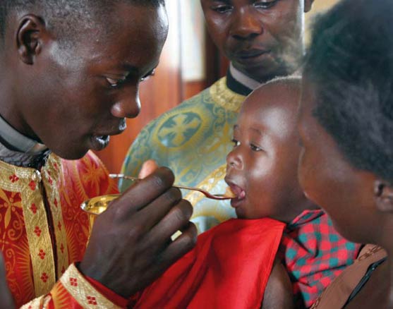 africa-orthodox-church-child-receives-holy-communion-at-st-nicholas-orthodox-church